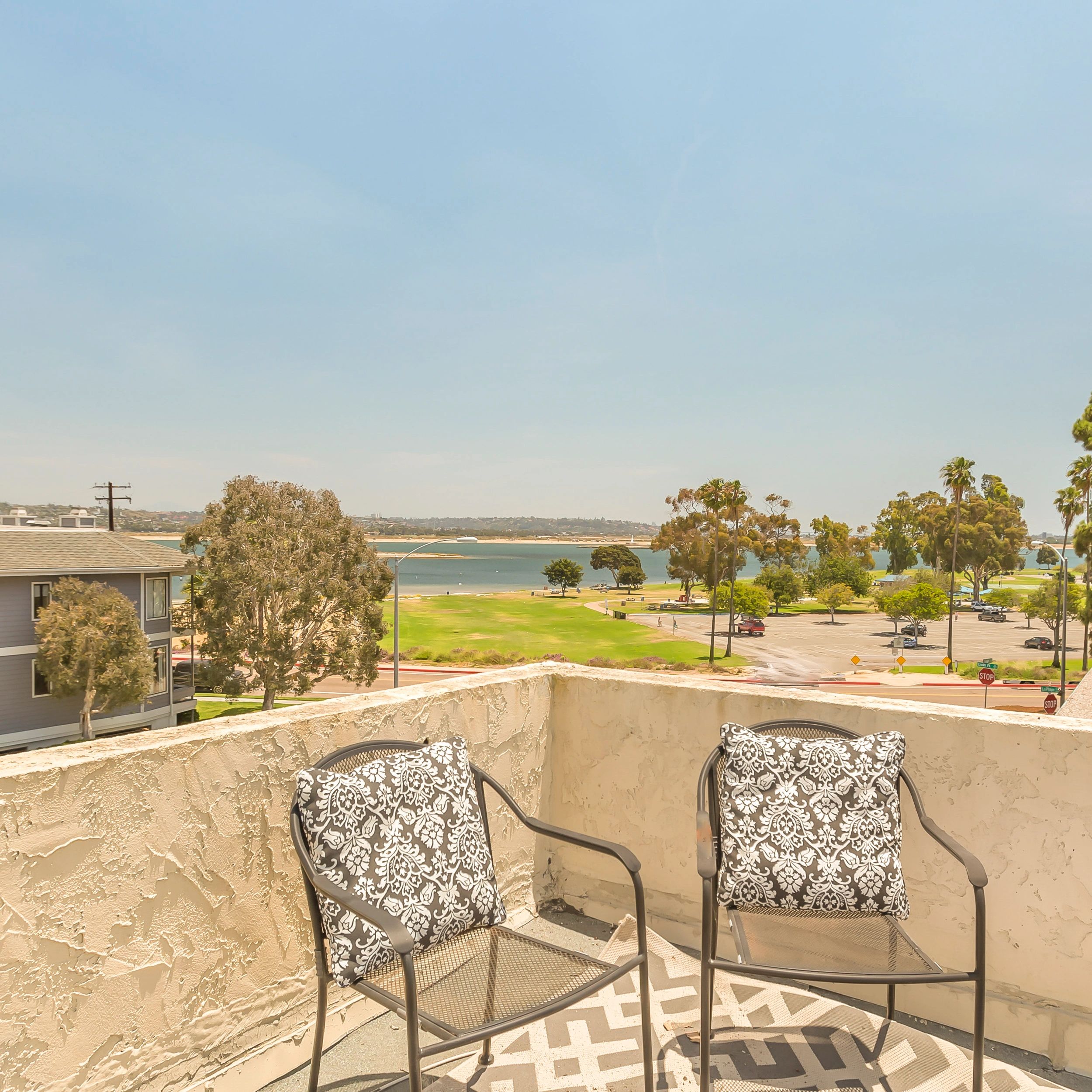 Waterfront patio chairs coastal view